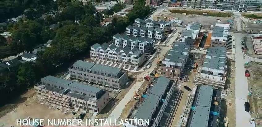 Aerial view of the Brightwater townhome rows and the waterfront, Port Credit