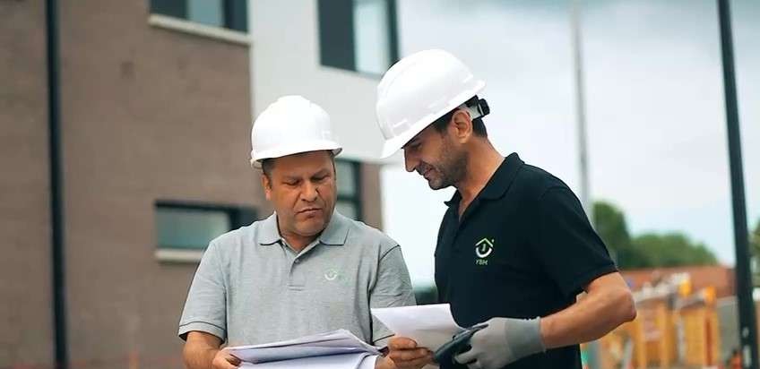 Two York team members reviewing drawings on the Brightwater site